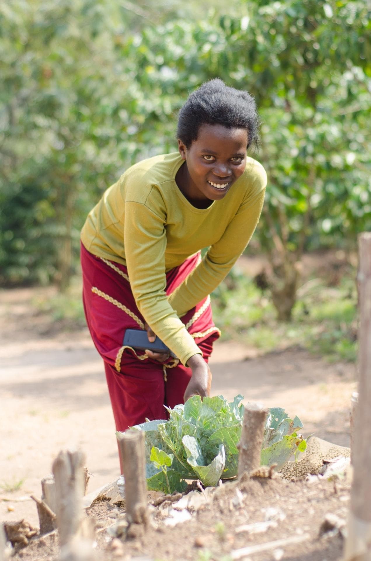 Cloudine in her coffee farm. Cloudine in her coffee farm.