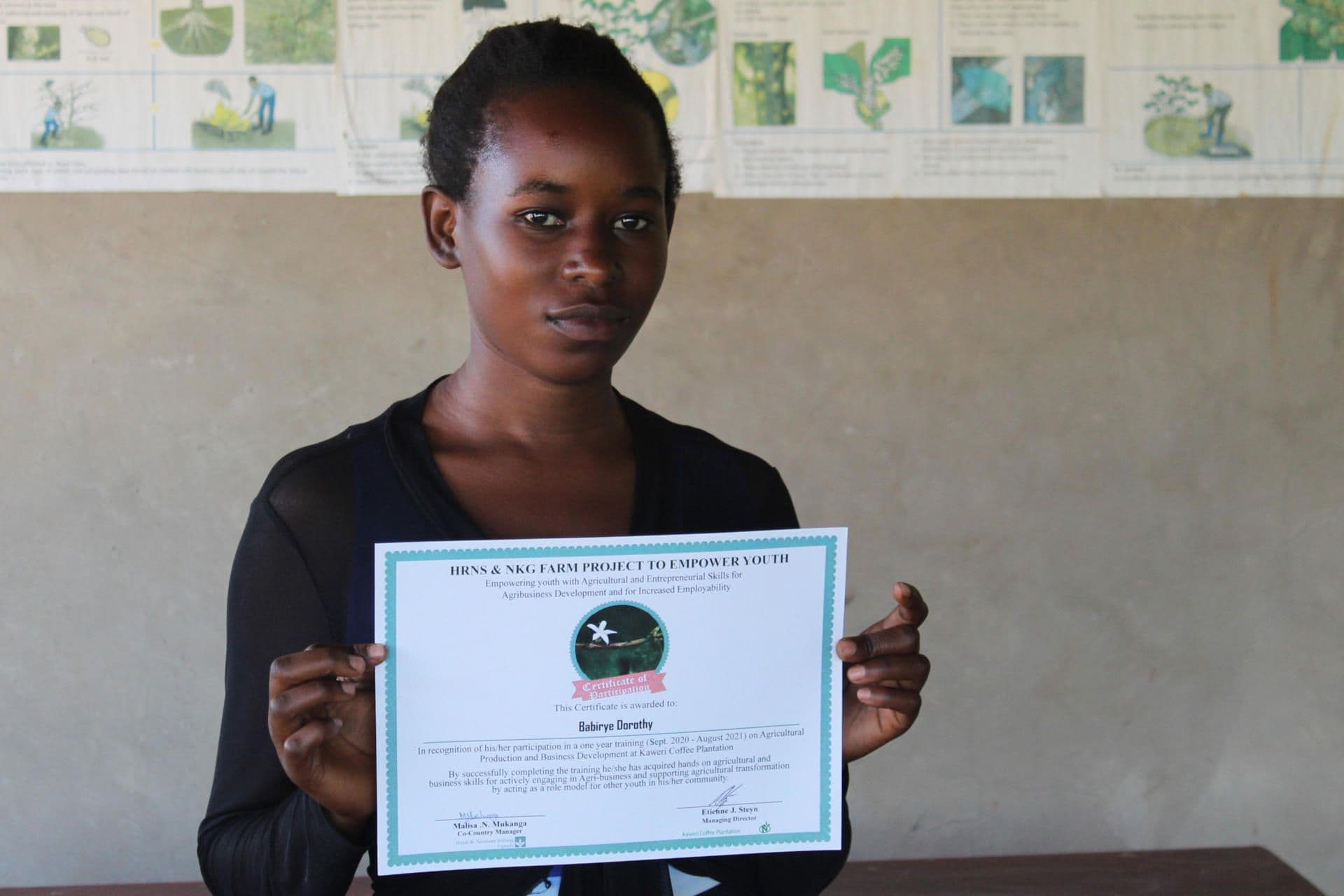 Dorothy receiving her certificate for completing the KYDP training Dorothy receiving her certificate for completing the KYDP training
